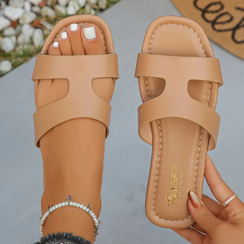 Sandalias planas tipo mule de mujer con tira única y corte calado, ajuste ancho, de PU, sin talón, antideslizantes, con suela fina, ideales para el verano, viajes a la playa y tallas grandes.