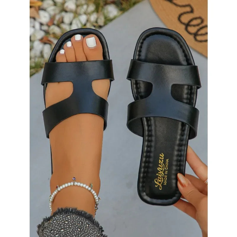 Sandalias planas tipo mule de mujer con tira única y corte calado, ajuste ancho, de PU, sin talón, antideslizantes, con suela fina, ideales para el verano, viajes a la playa y tallas grandes.